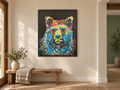 Andy’s Bear painting displayed at the approved scale above a wooden bench in a warm natural room.